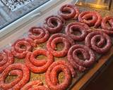 A picture of step 1 of Boerewors with mashed potatoes served with a tomato chili relish.