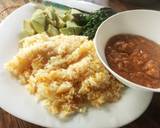 A picture of step 7 of Carrot cumin rice served with peanut sauce and veggies.