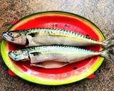 A picture of step 1 of Mackerel in sour cream, with broccoli and tomatoes, in the oven.