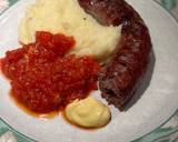 A picture of step 5 of Boerewors with mashed potatoes served with a tomato chili relish.